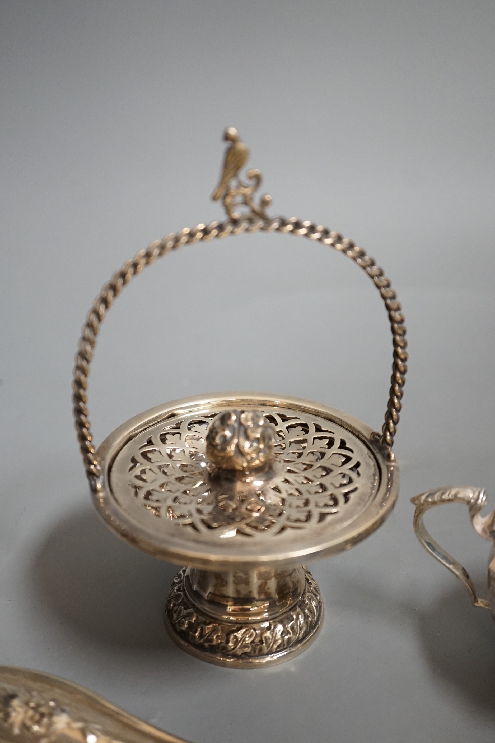 A white metal handled tortoiseshell paper knife and sundry small silver items, including an Edwardian pot pourri basket and two silver condiments by Elkington & Co.